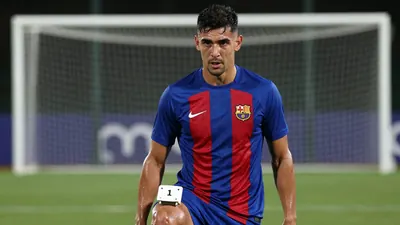 Mid-30s muscular forward, waist-up, intense gaze, right foot poised on a spotless penalty spot, blue and red striped...