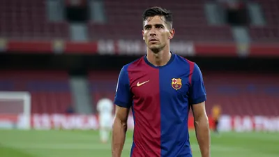 A 35-year-old, 5'10" Málaga CF midfielder, wearing a plain blue and red striped jersey made of high-quality cotton...